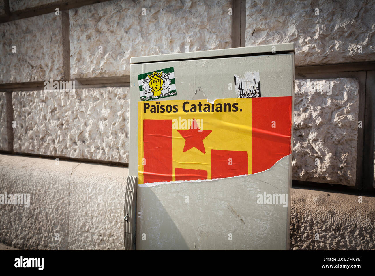 Catalan independence flag sticker on traffic lights control box. Barcelona. Catalonia. Spain. Stock Photo