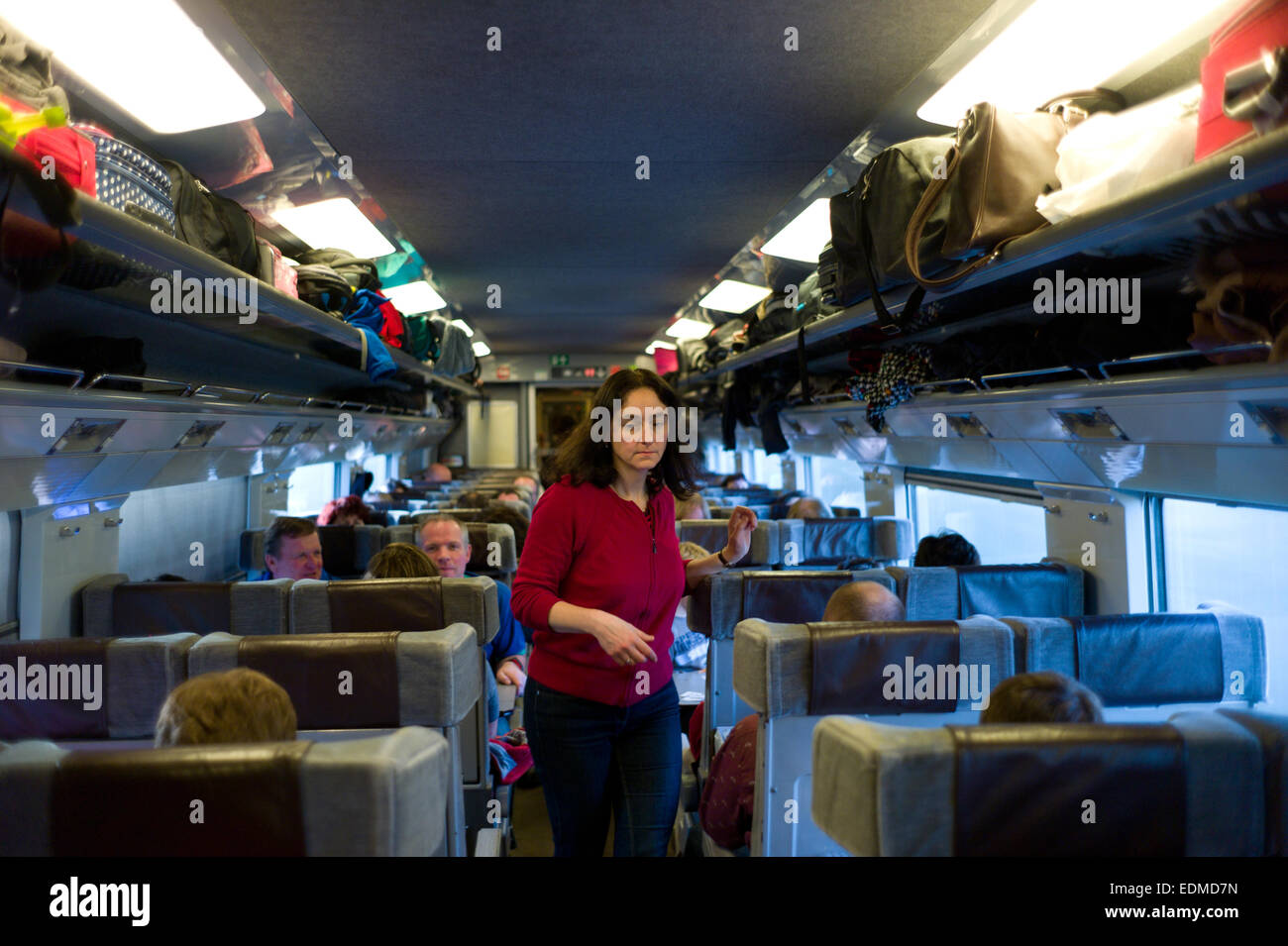 A woman on a Eurostar train on its way to Brussels from England Stock Photo