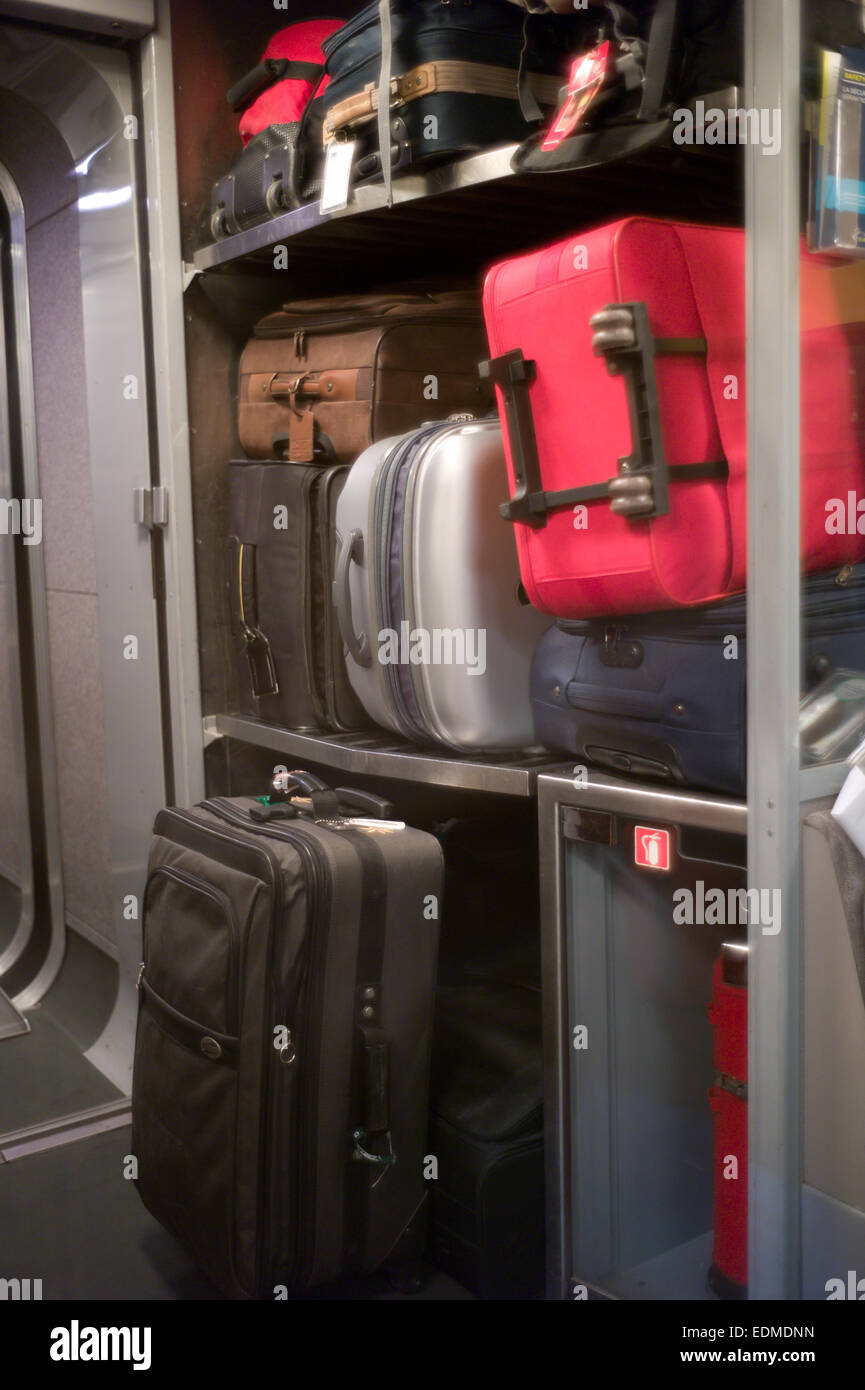 Luggage Stacked on the racks of a Eurostar Train between England and France Stock Photo