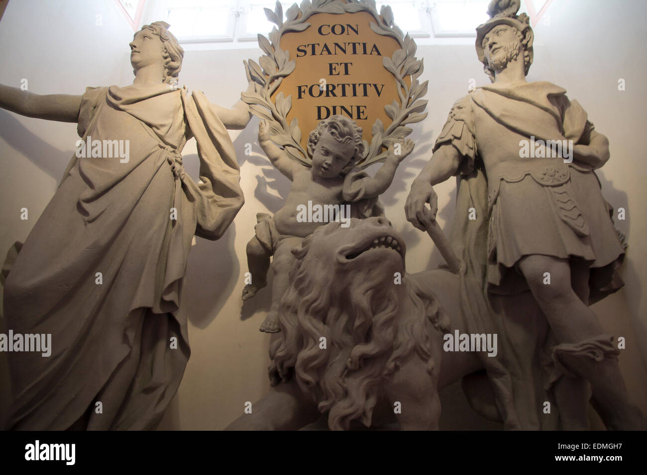 Allegorical statuary on Imperial Staircase at Melk Abbey. Inscription "constantia et fortitudine" (perseverance and fortitude) Stock Photo
