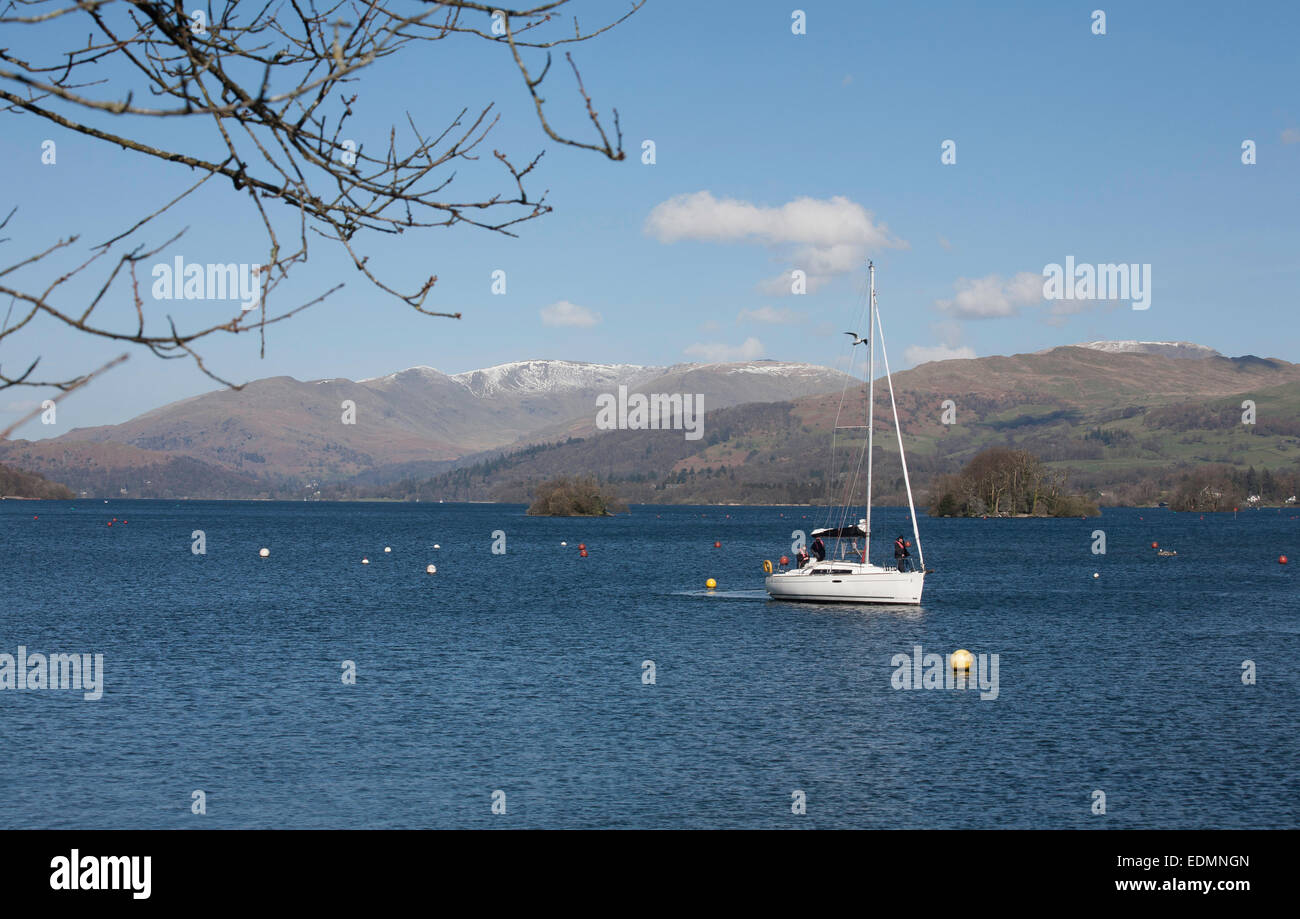 Yacht sailing on Windermere with The Fairfield Horseshoe above