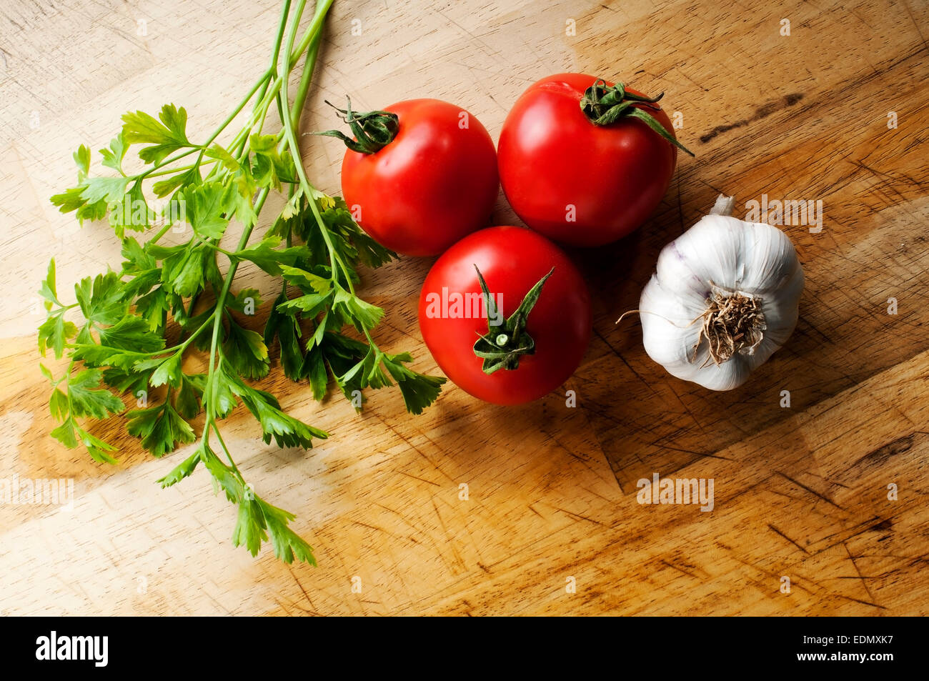 typical vegetables for seasoning in Mediterranean cuisine in the same colors of the Italian flag Stock Photo