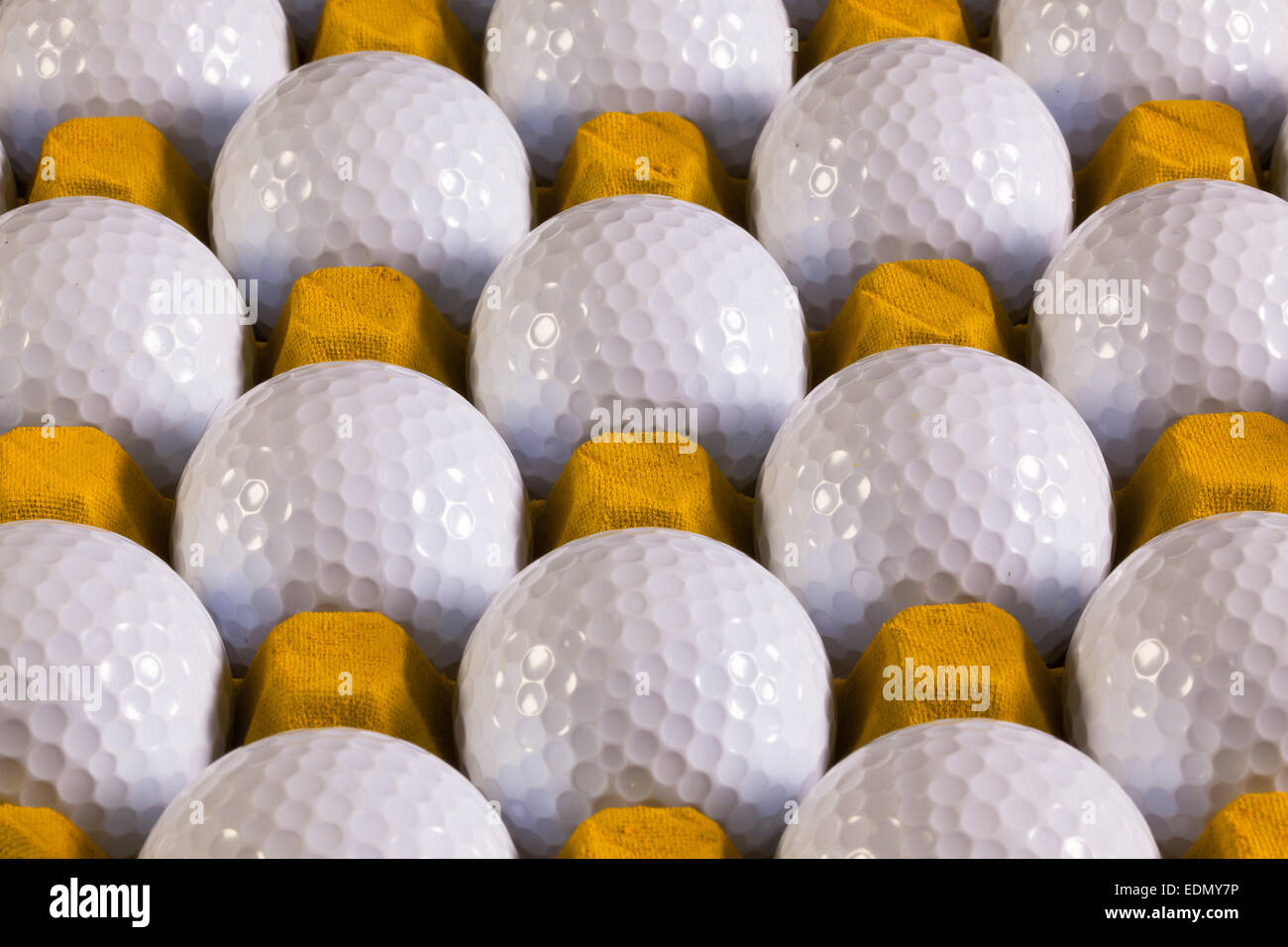 Golf balls in paper carton for eggs Stock Photo Alamy