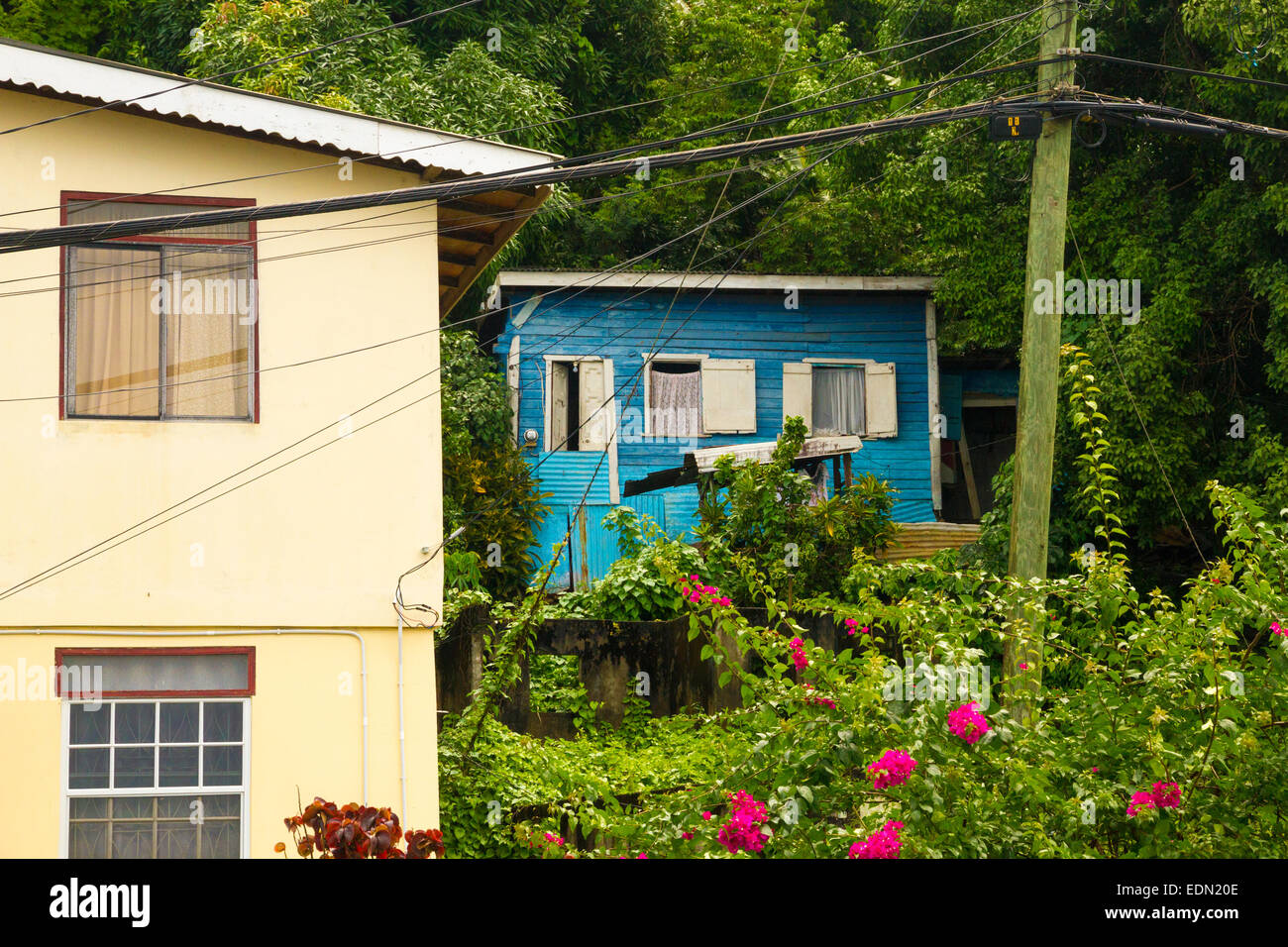 A blue house set back from the road in Grenada West Indies Stock Photo