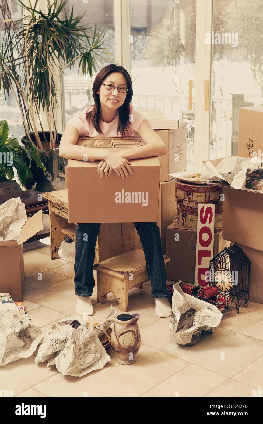 Asian womans first home Stock Photo