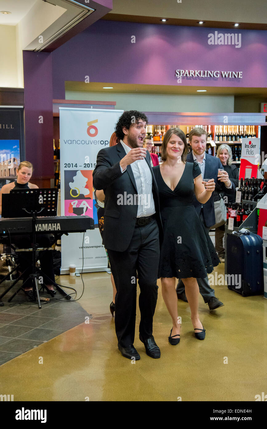 Promotional appearance by Vancouver Opera singers in Liquor store. Stock Photo