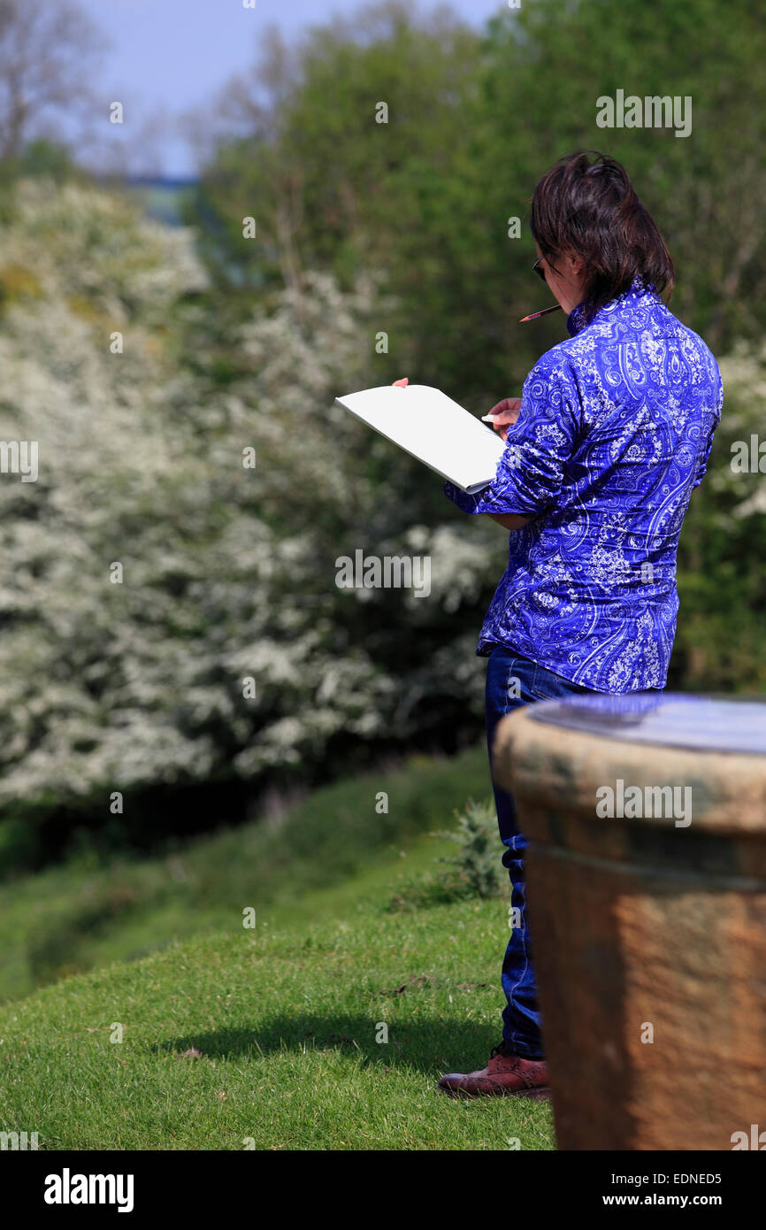 Artist sketching at Dover’s Hill, Campden, Gloucestershire, England, uk Stock Photo