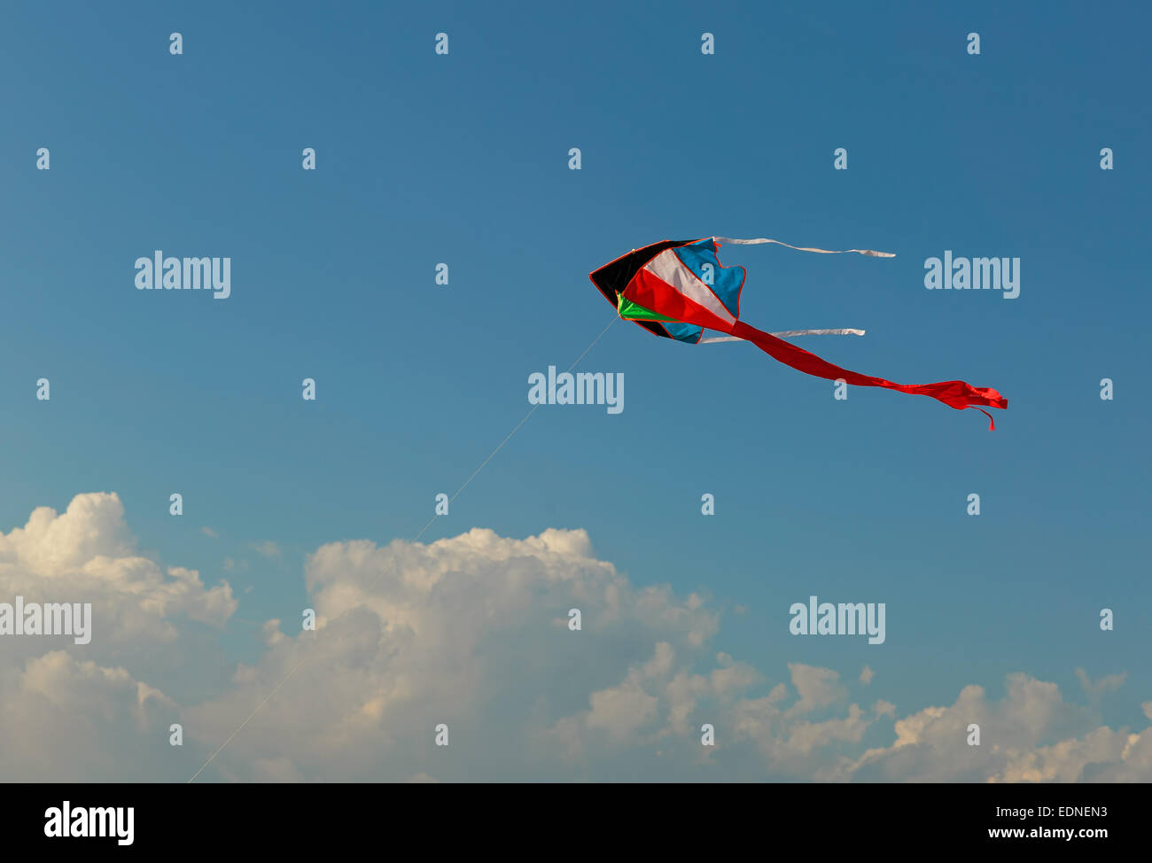 Kite flying on the sky background Stock Photo - Alamy