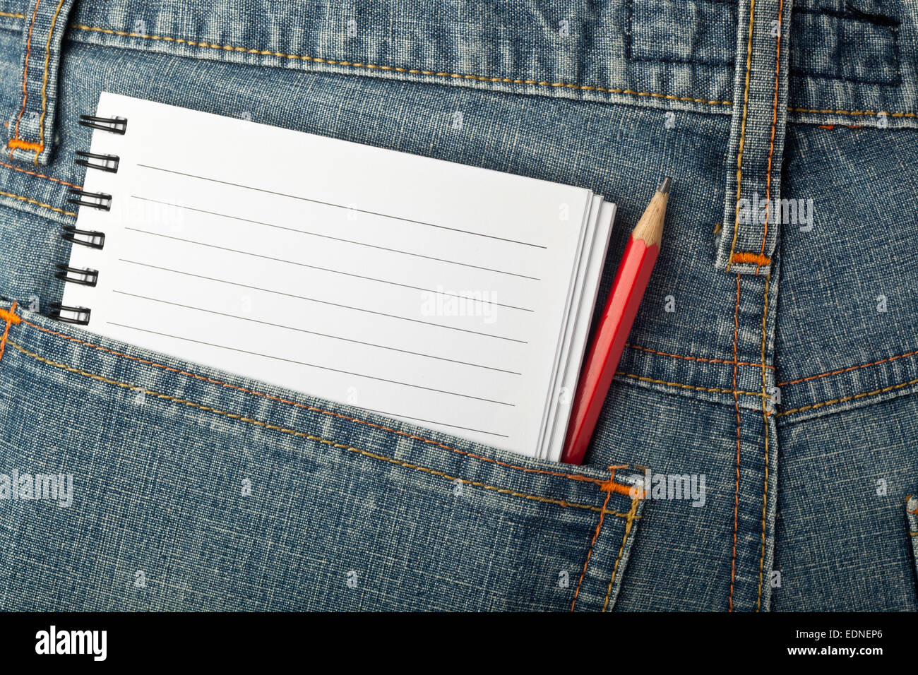 Notepad and pencil in jeans back pocket Stock Photo
