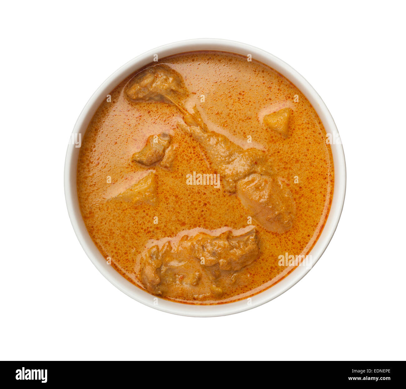 Bowl of curry chicken with lots of gravy isolated on white background Stock Photo