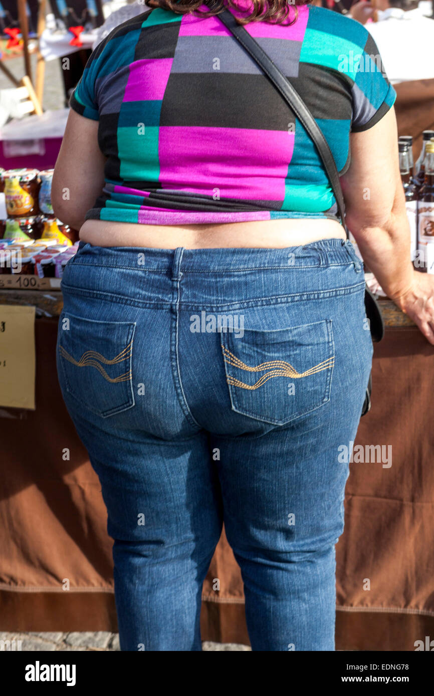 Obese woman rear view obesity woman jeans Rear View Back on street Overweight woman Stock Photo