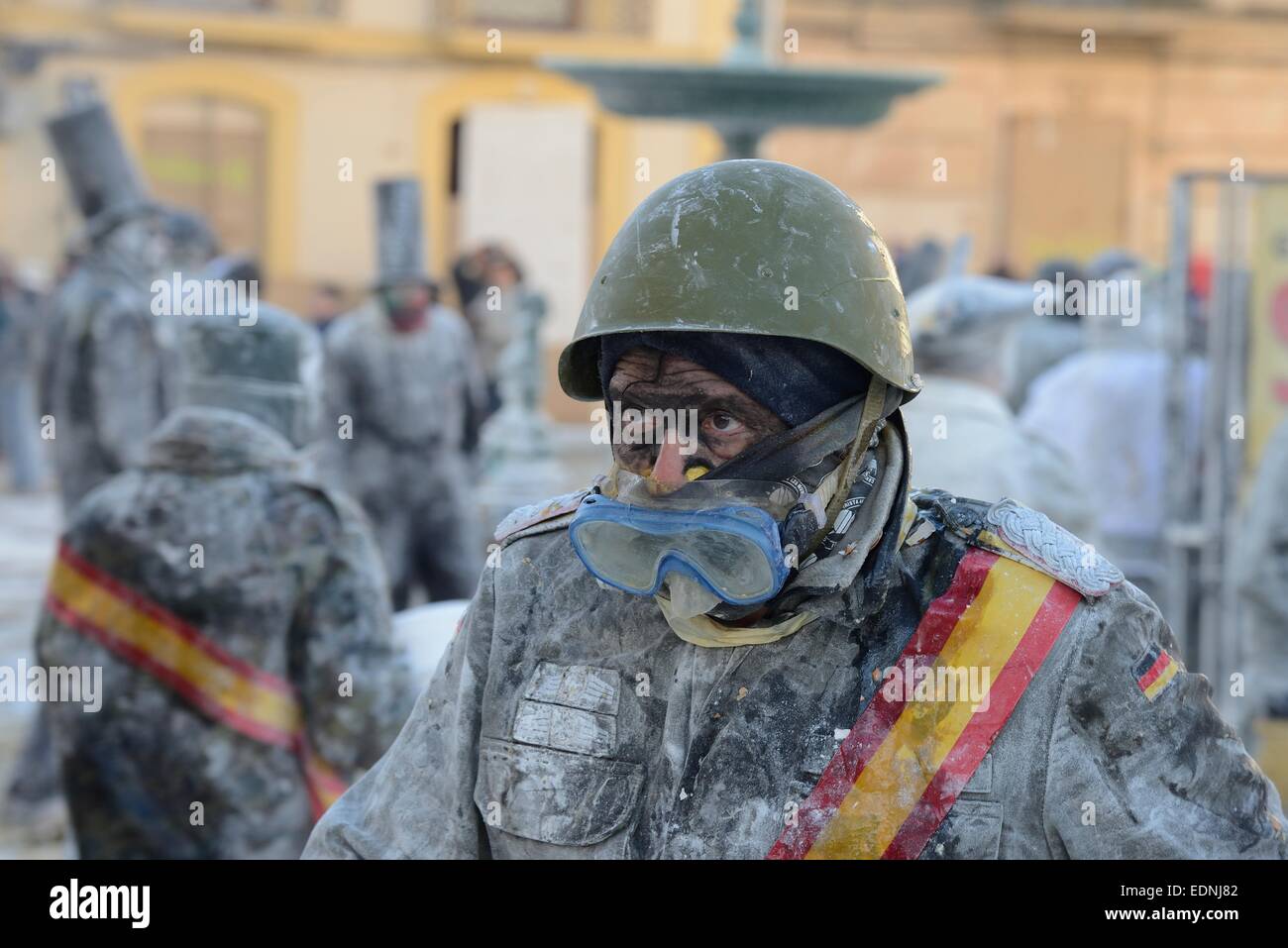 Man wearing goggles, Els Enfarinats flour fight, rebels, armed with flour, eggs and firecrackers, take over the regiment of the Stock Photo
