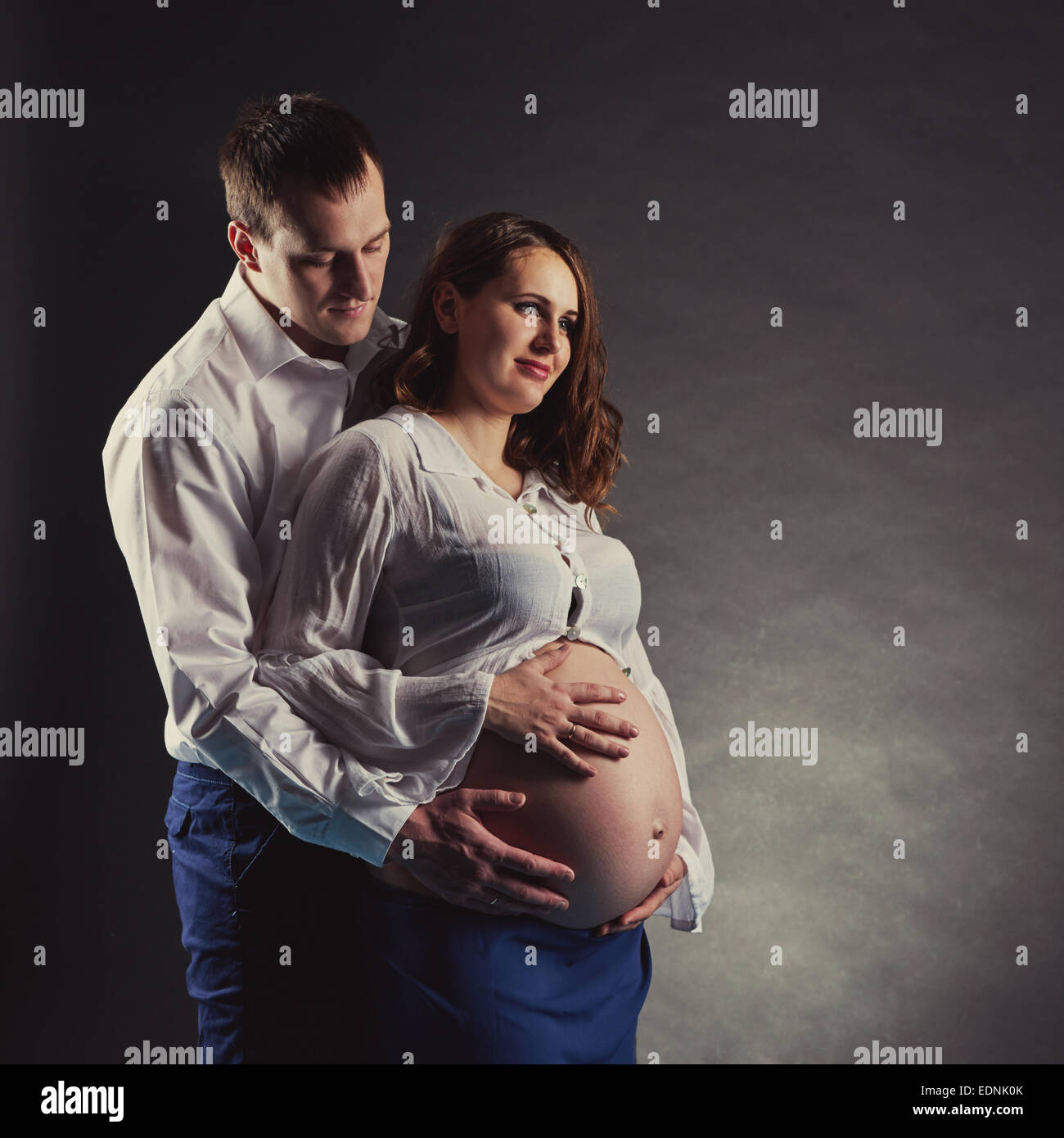 a man with a pregnant woman Stock Photo - Alamy