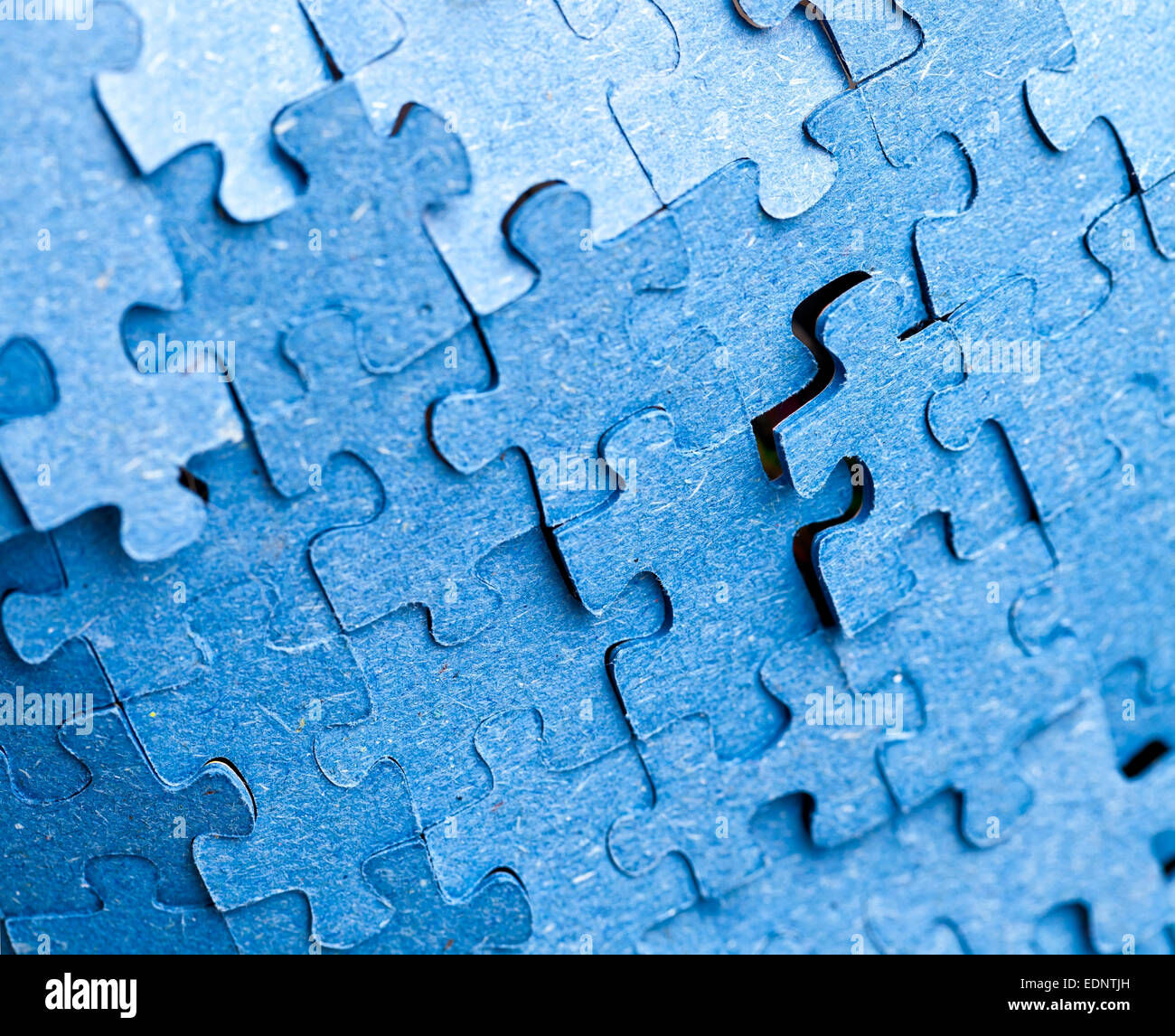Real photograph of the backside of blue puzzle jigsaw in available light  Stock Photo - Alamy