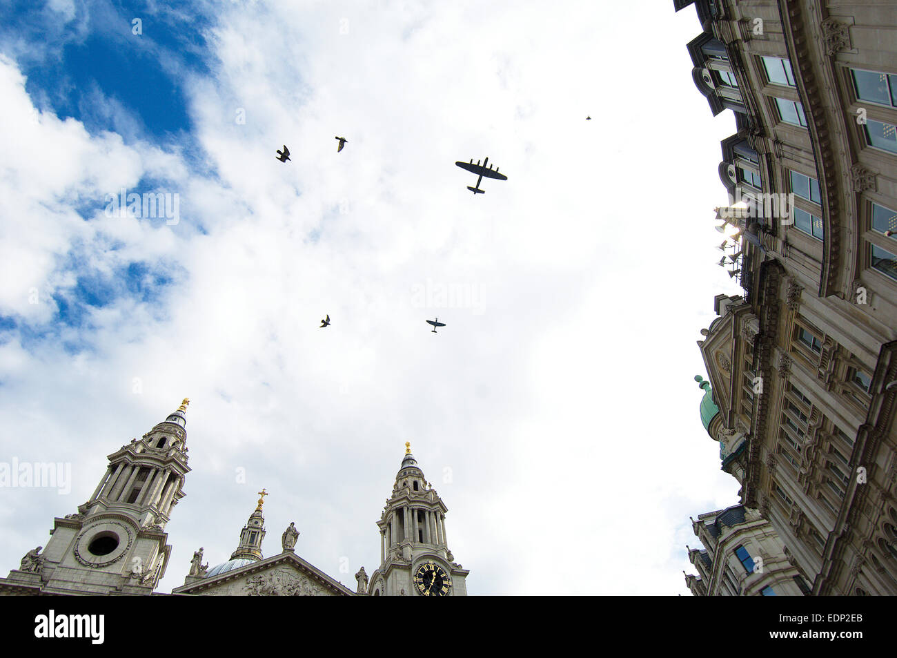 A fly-past of a Lancaster Bomber and a Spitfire marking 70 years since the Blitz.  St. Paul’s Cathedral was the focal Stock Photo
