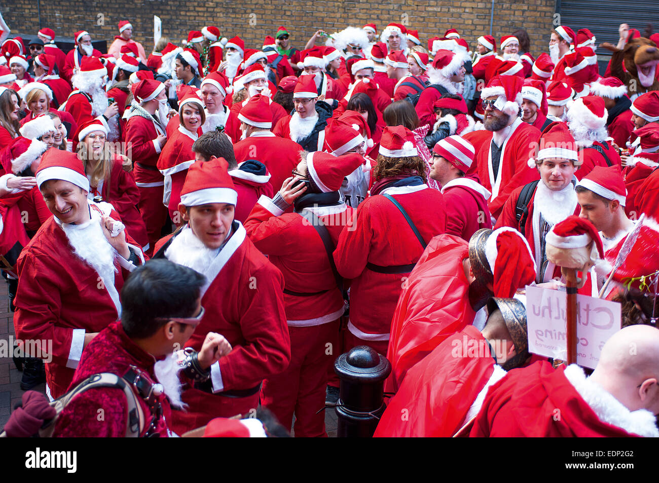 Hundreds of Santas gather for the annual pub-crawl/flashmob in London called Santacon. Stock Photo