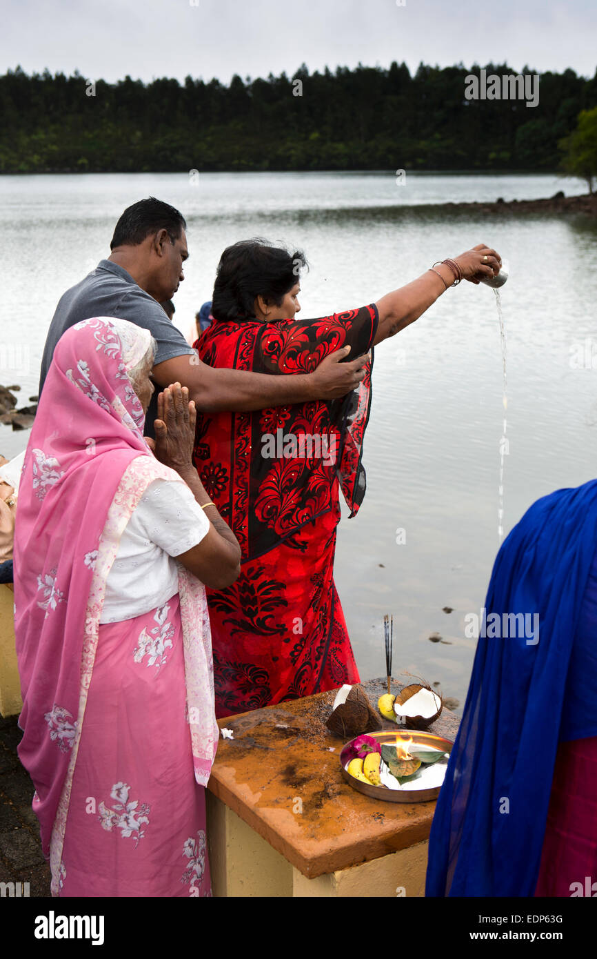 Mauritius, Grand Bassin, Ganga Talao sacred lake temple, family performing lakeside puja Stock Photo