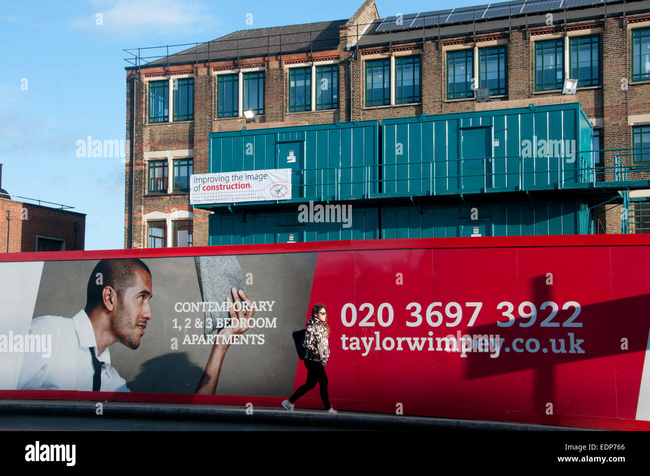 Hackney, London. Dalston Curve new housing development with advert in