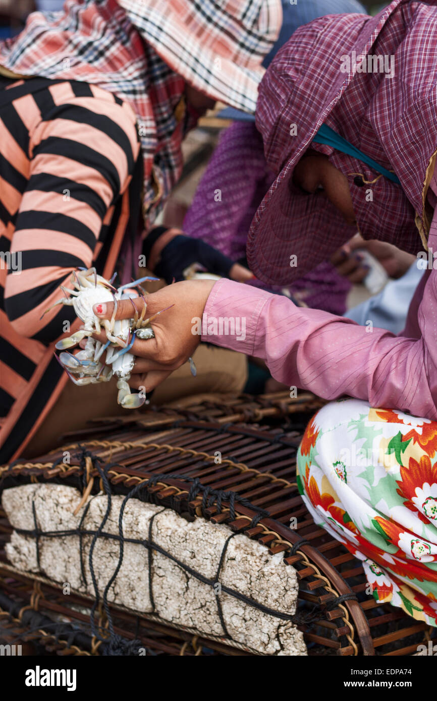 Women sell crabs at famous crab market in Kep, Cambodia Stock Photo