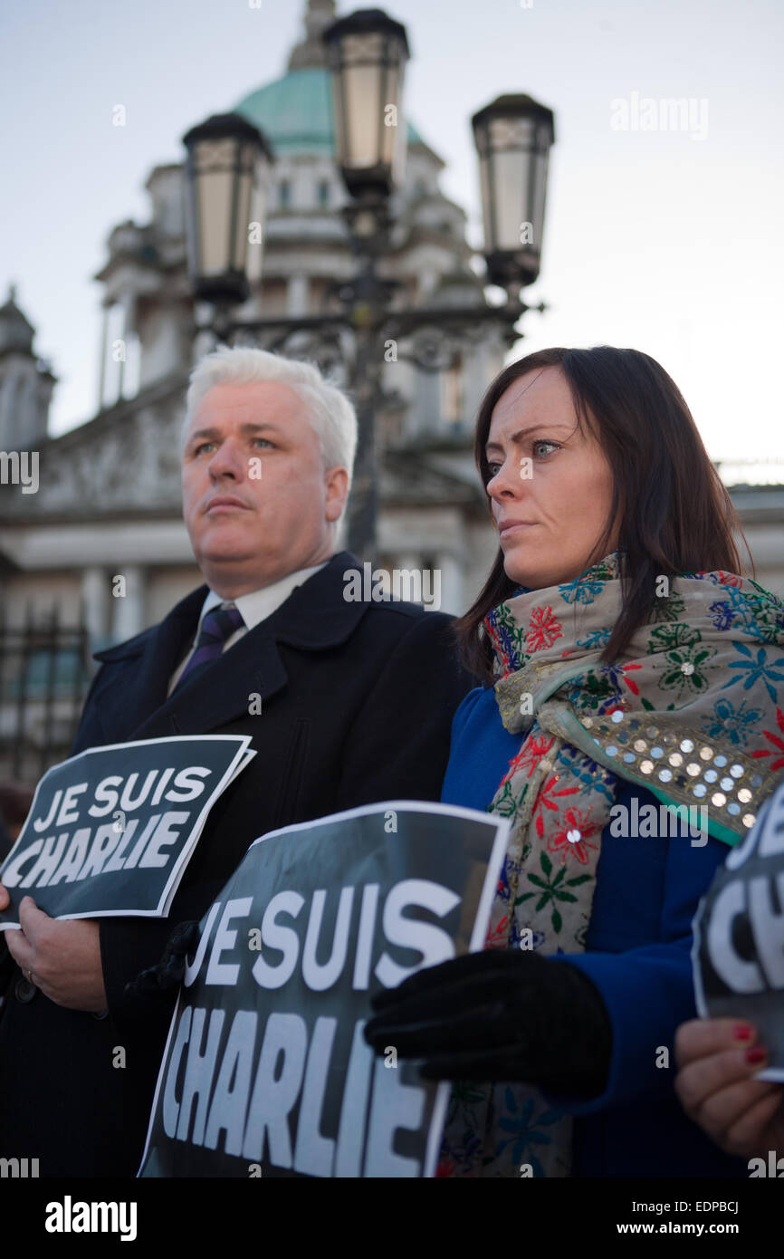 Belfast, UK. 8th January, 2015. Journalist Fearghal McKinney  and Lord Mayor of Belfast Nichola Mallon (R) holding a Je Suis Charlie posters outside Belfast City Hall. the Silent Vigil was held in Remembrance of those killed in the Paris Attack Credit:  Bonzo/Alamy Live News Stock Photo