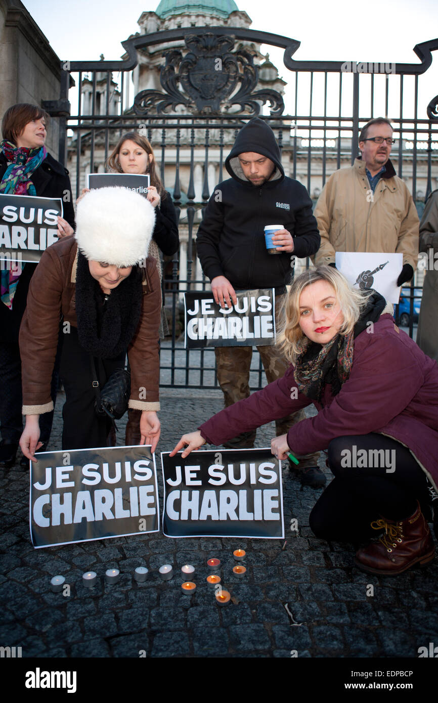 Belfast, UK. 8th January, 2015. Member of the NUJ and Amnesty International holding a Je Suis Charlie posters outside Belfast City Hall. the Silent Vigil was held in Remembrance of those killed in the Paris Attack Credit:  Bonzo/Alamy Live News Stock Photo