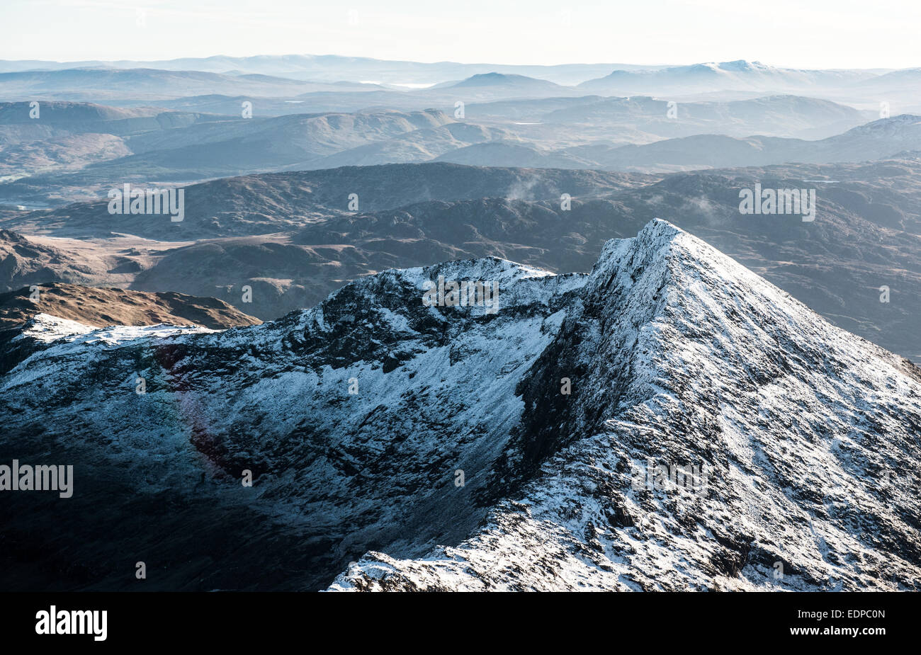 Displaying the North Wales mountain range, Snowdonia from the top of the highest mountain in Wales, Snowdon. Stock Photo