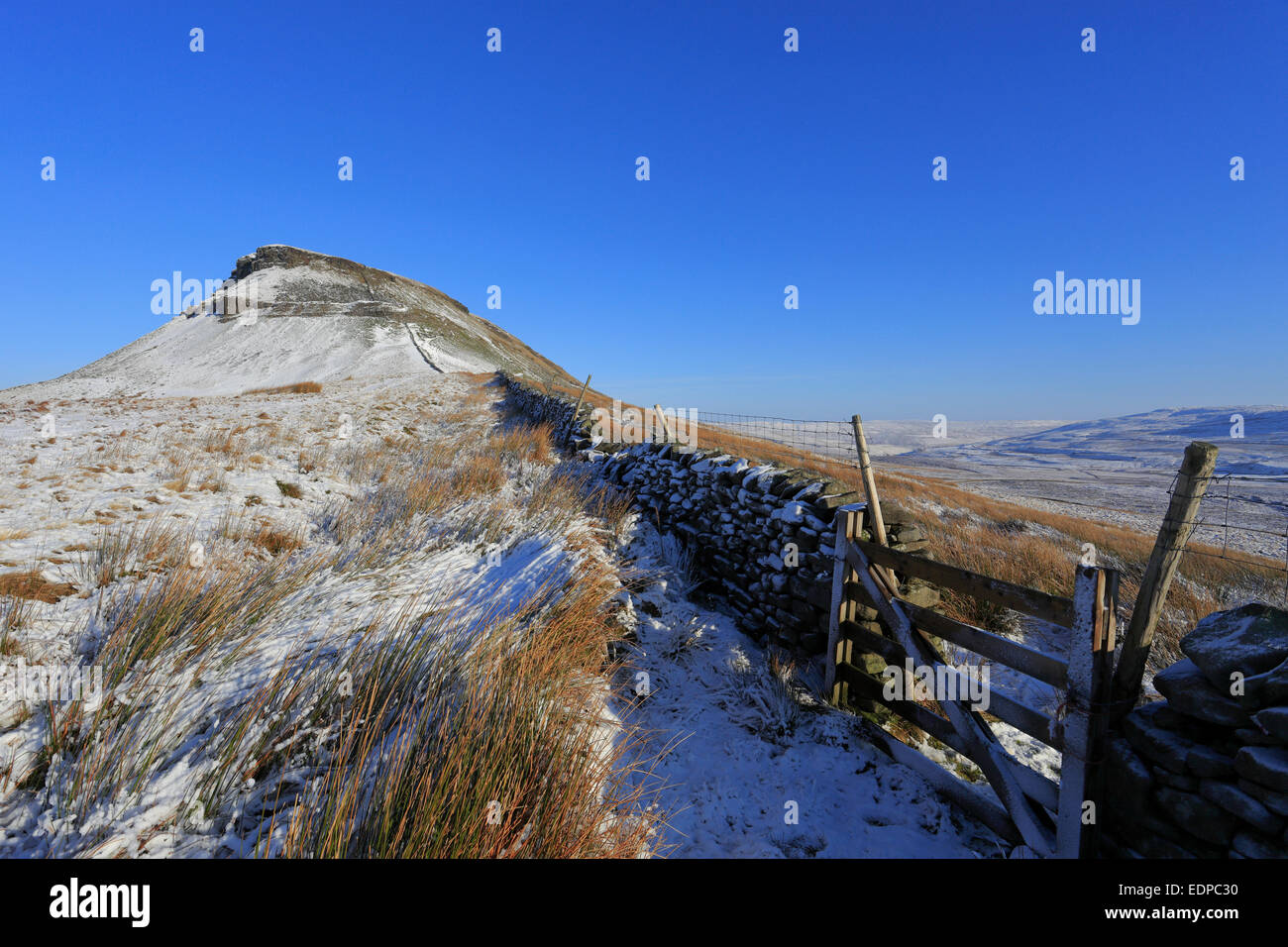 Snowy Pen-y-ghent on the Pennine Way, Yorkshire Dales National Park, North Yorkshire, England, UK. Stock Photo