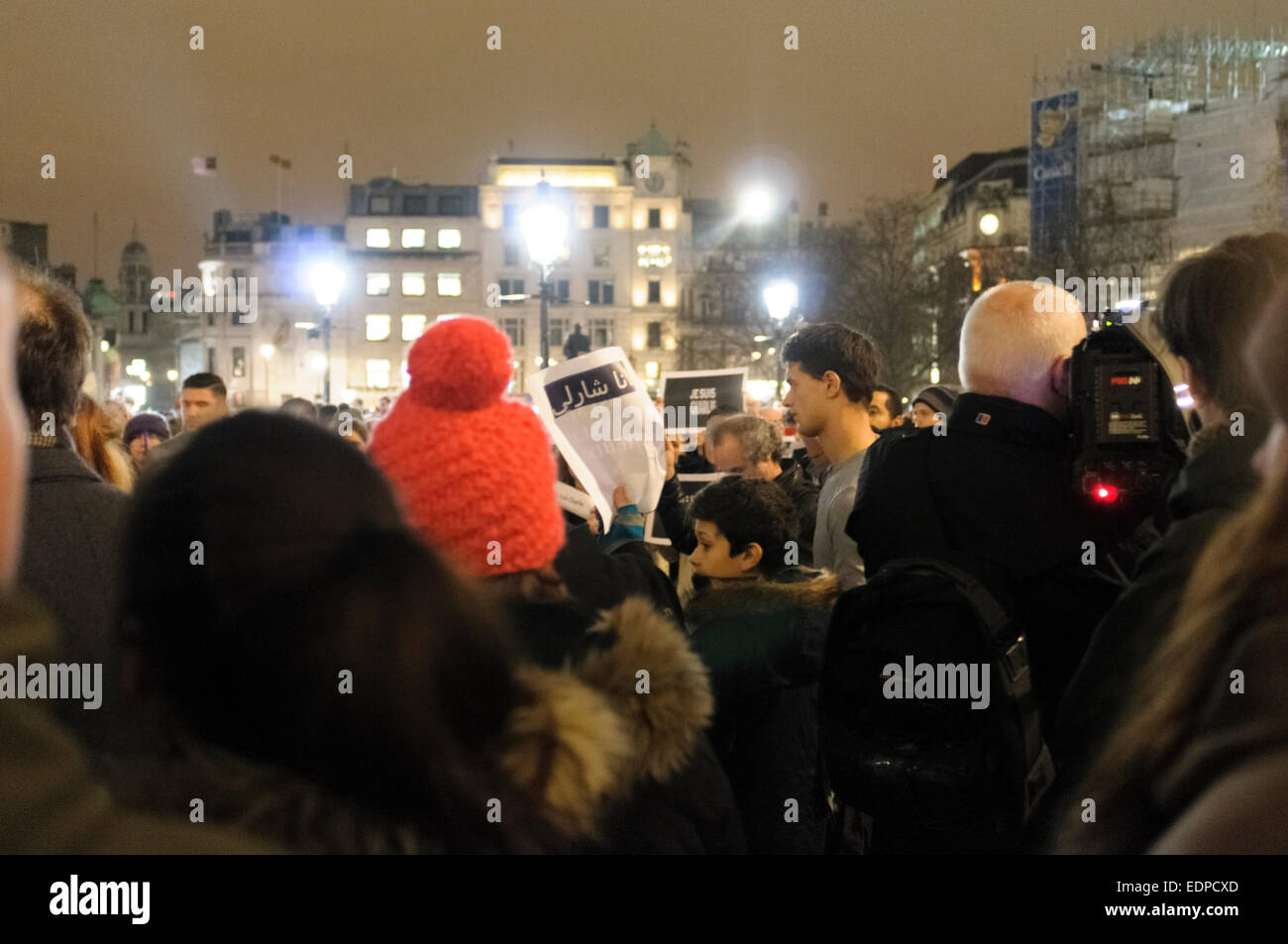 London, UK. 7th January, 2015.  People gathered in Trafalgar Square to show their support to the victims of the terrorist attack against the French magazine Charlie Hebdo. They are holding placards with words “Je Suis Charlie” (I am Charlie). Fourteen people were killed including  two police officers when two to four masked gunmen opened fire at the headquarter of Charlie Hebdo in Paris, France Credit:  onebluelight.com/Alamy Live News Stock Photo