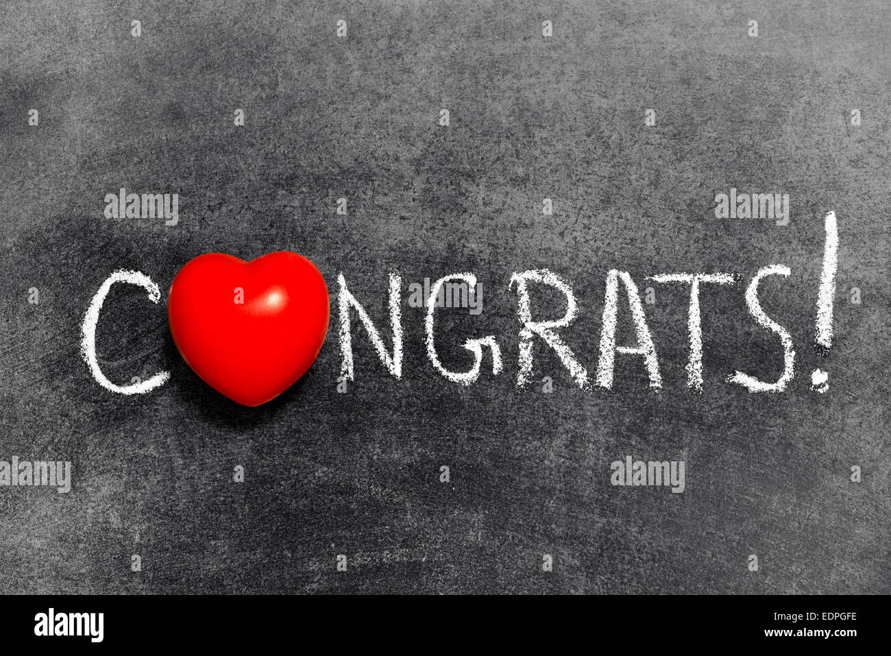 congrats exclamation handwritten on blackboard with heart symbol instead of O Stock Photo