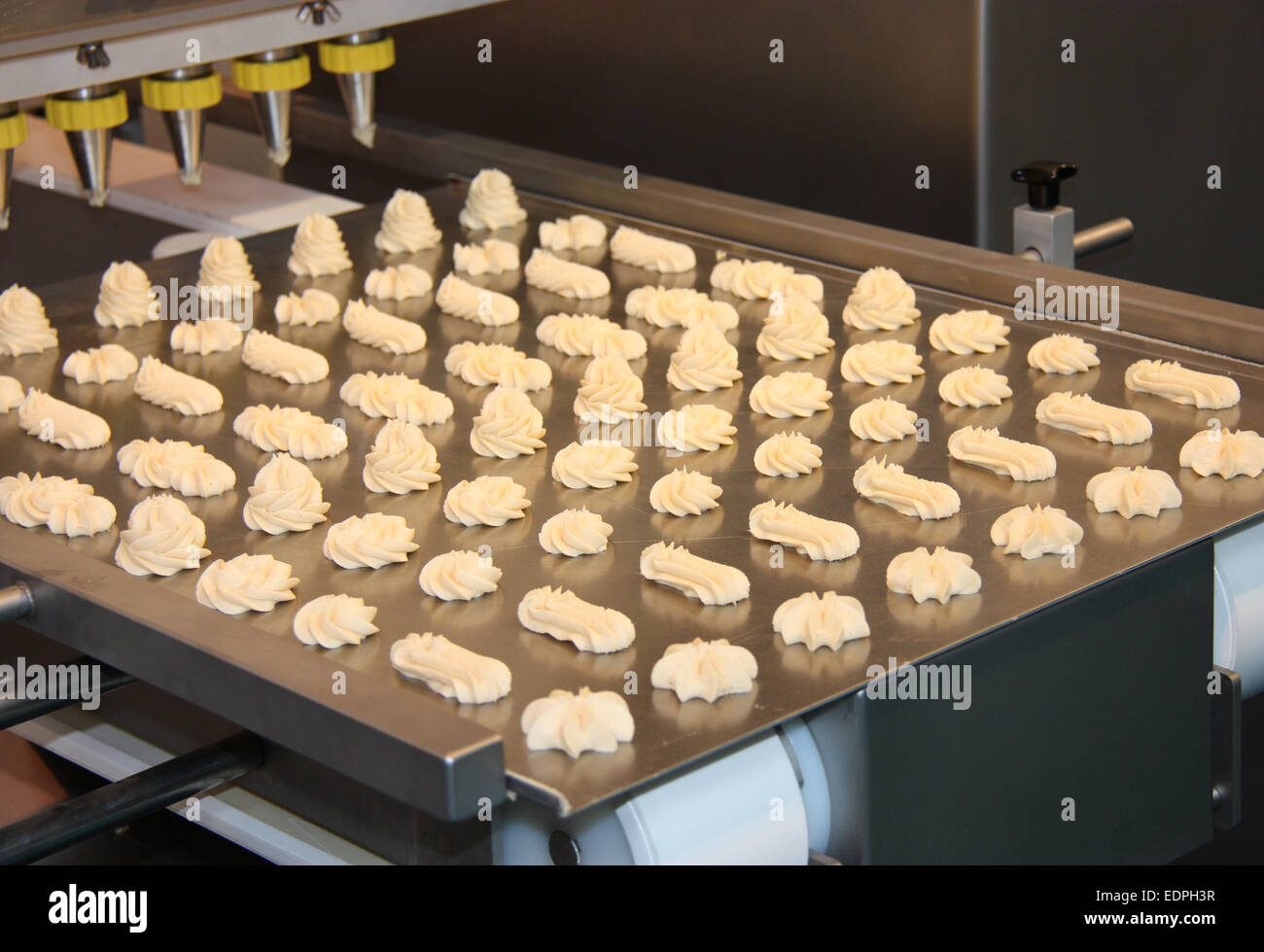 Food Processing Machine Making Mixed Various Shapes. Stock Photo