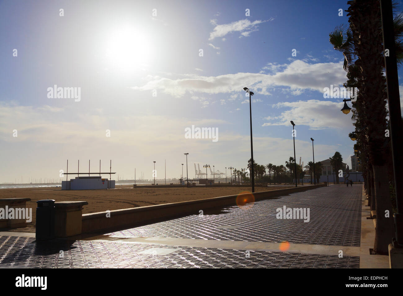 Bright sunshine on a deseted promenade beach at Valencia Spain Stock Photo