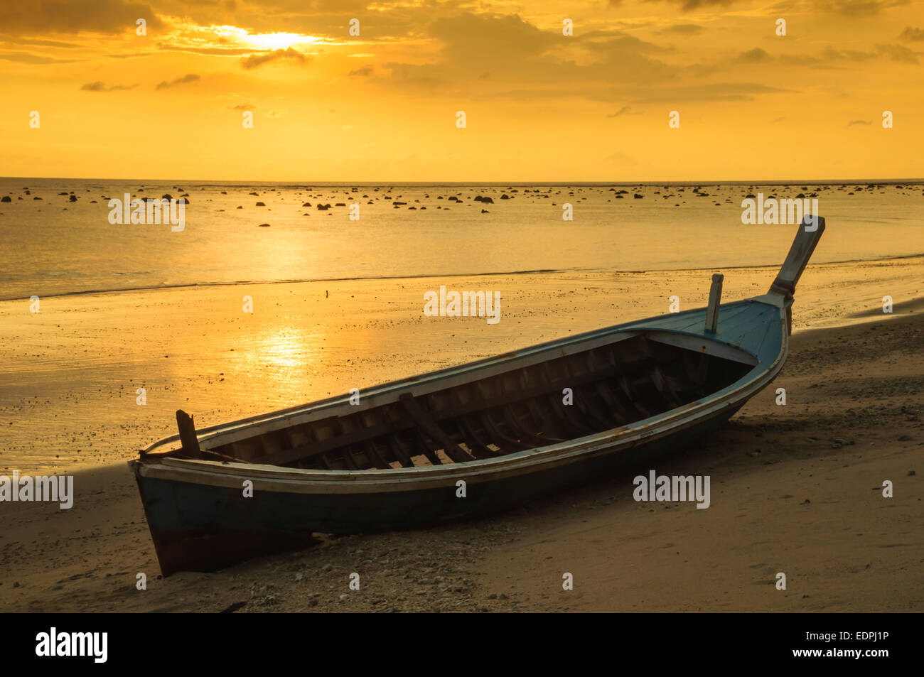 Silhouette boat at beach and sunset Stock Photo - Alamy