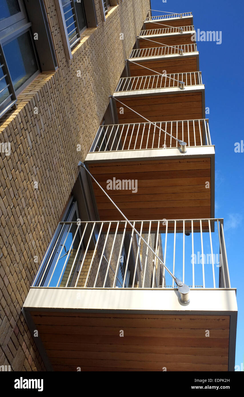 Apartment balconies rising into a blue sky Stock Photo Alamy