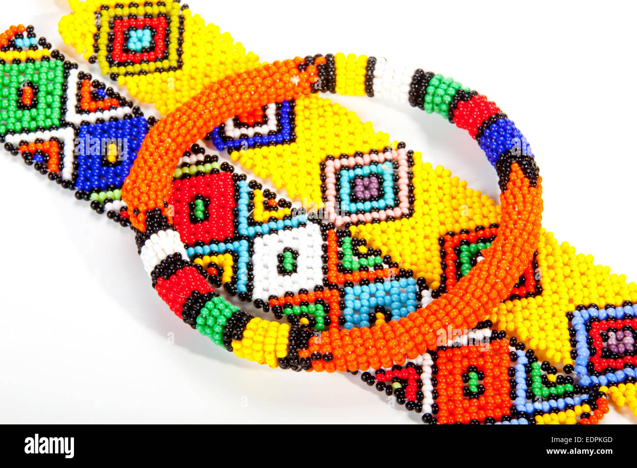 circular beaded Zulu armband atop two wristbands Stock Photo