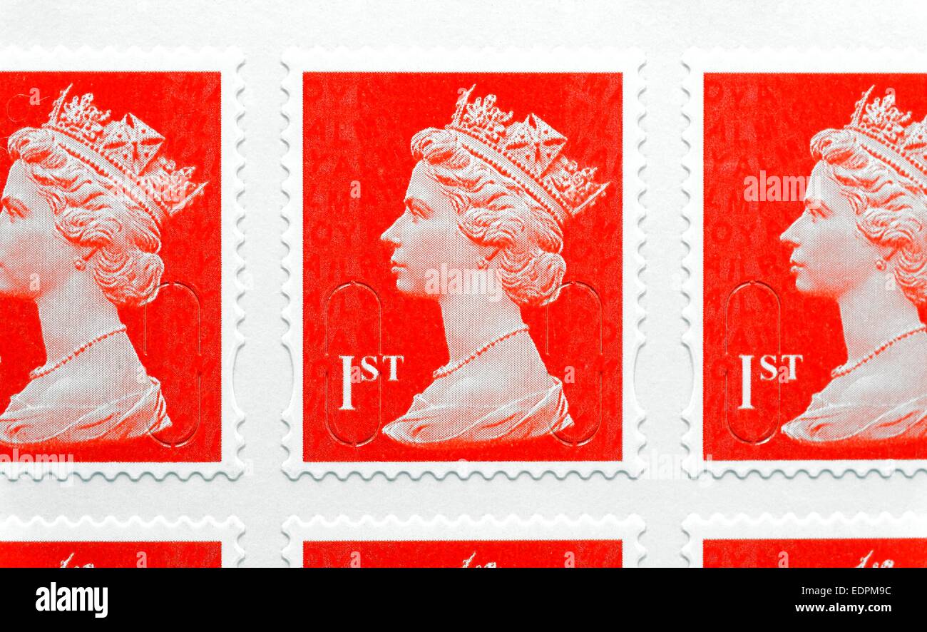 Red British first class royal mail postage stamps Stock Photo