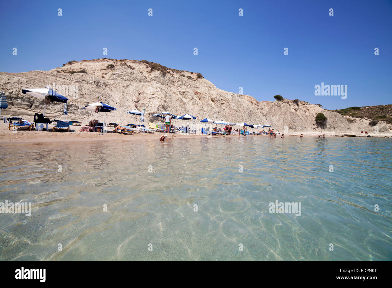 Kolymbia beach with its clear sea water and cliff behind. Rhodes island, Greece Stock Photo