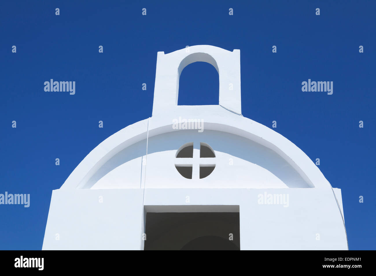 New Greek chapel by the sea white against blue. Kolymbia beach, Rhodes Island Stock Photo