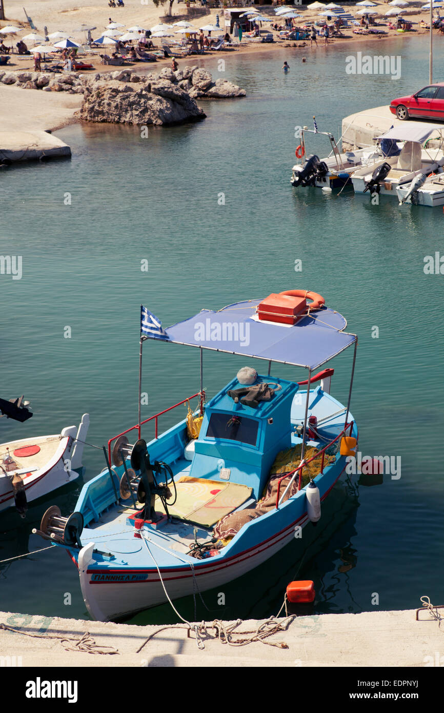 Traditional fishers boat in Kolymbia little harbor bay, Rhodes Island, Greece Stock Photo