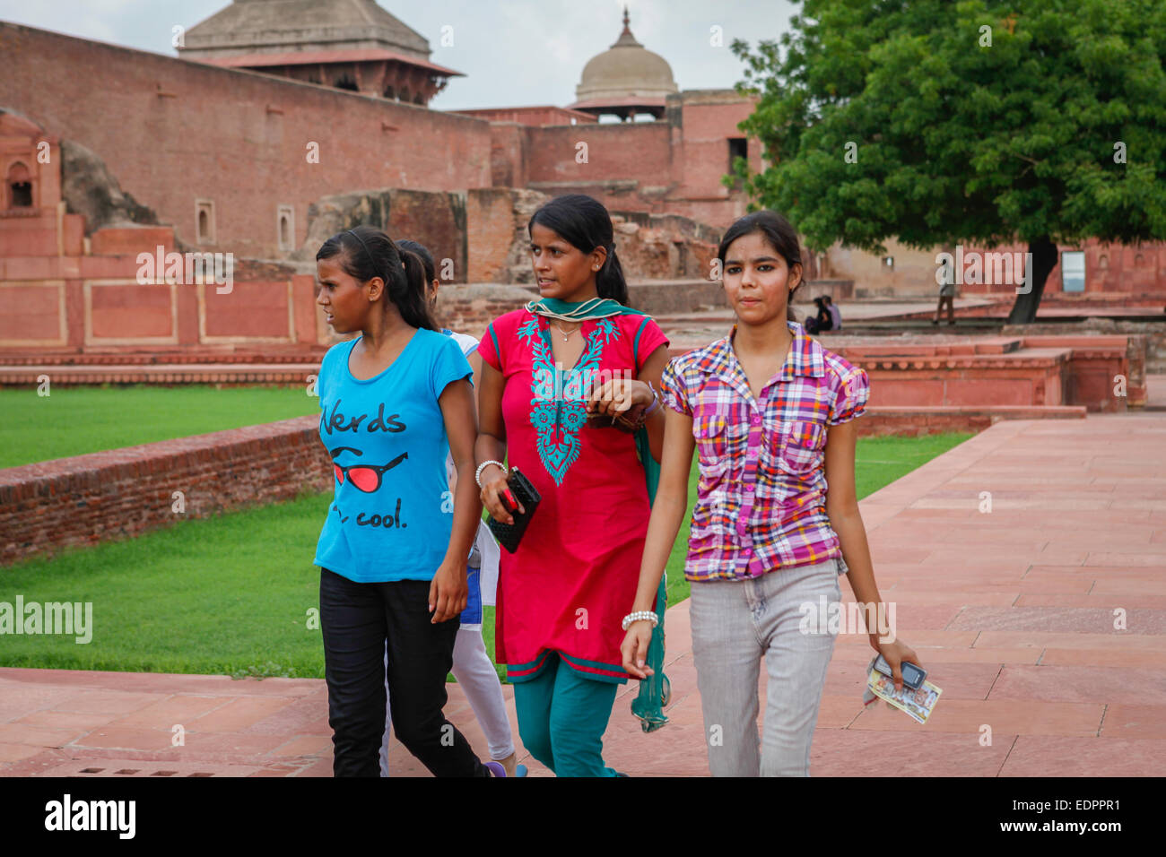 Indian young girls passing through the plaza of The Jahangiri Mahal in Agra Fort. Stock Photo
