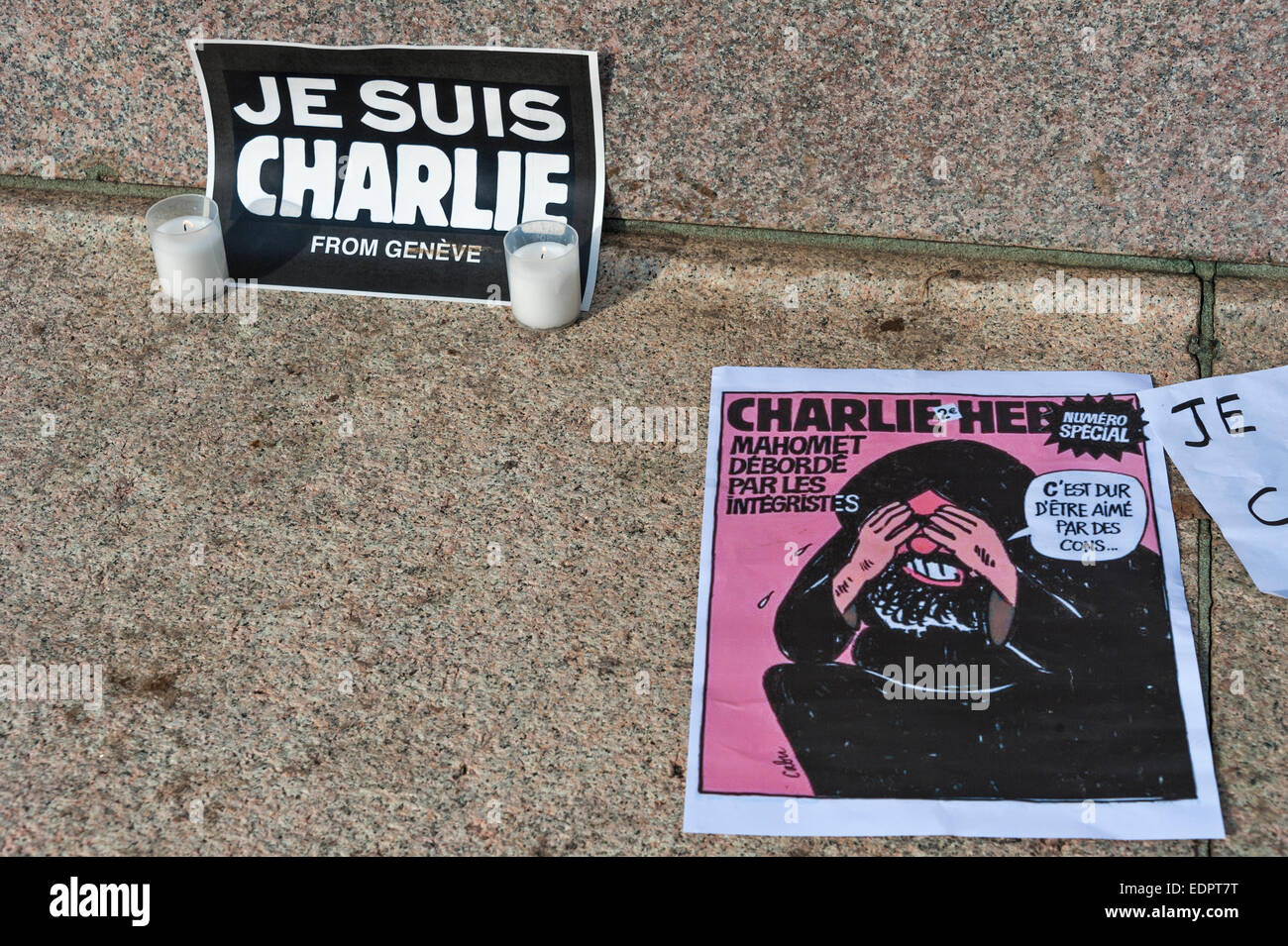 Geneva, Switzerland. 8th January 2015. Posters and signs put up when Swiss journalists, writers and members of International PEN attended a vigil in Geneva's Place de Neuve to show solidarity with the victims of the attack against Charlie Hebdo. Credit:  Alistair Scott/Alamy Live News Stock Photo