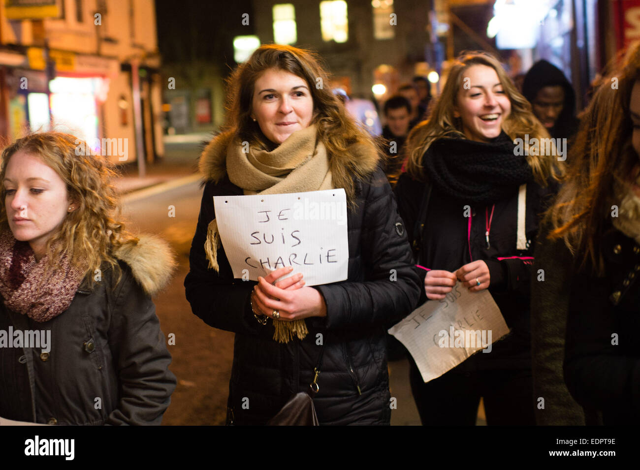 Aberystwyth Wales UK, Thursday 8 January  2015  Young french students at Aberystwyth University  taking part in a 'Je Suis Charlie / Nous Sommes Tous Charlie'  vigil and memorial walk in Aberystwyth remembrance of the 12 people shot dead at the offices of satirical cartoon  magazine Charlie Hebdo in Paris on Jan 7 2015    Credit: keith morris / Alamy Live News Stock Photo