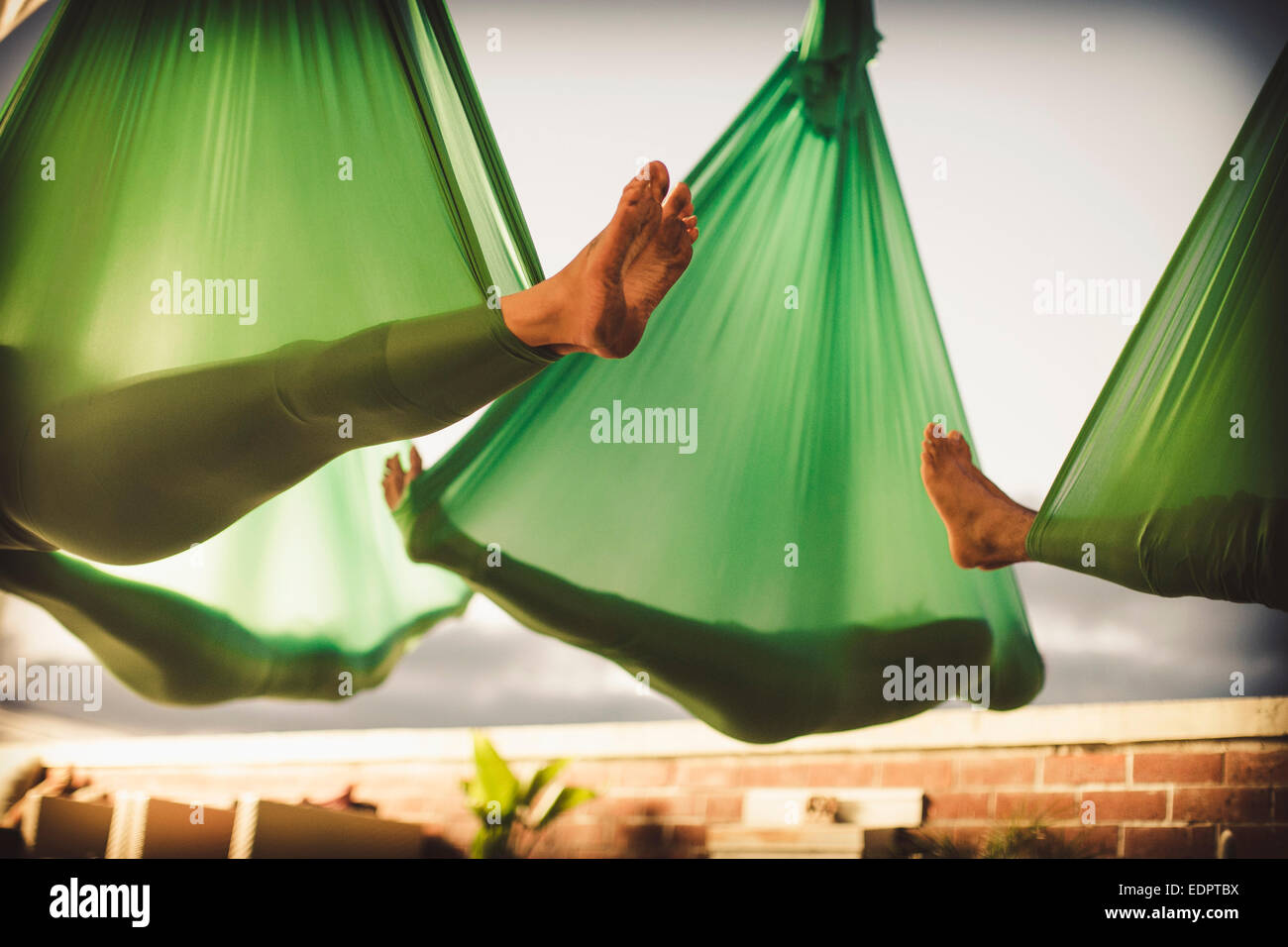 Hanging yoga hi-res stock photography and images - Alamy