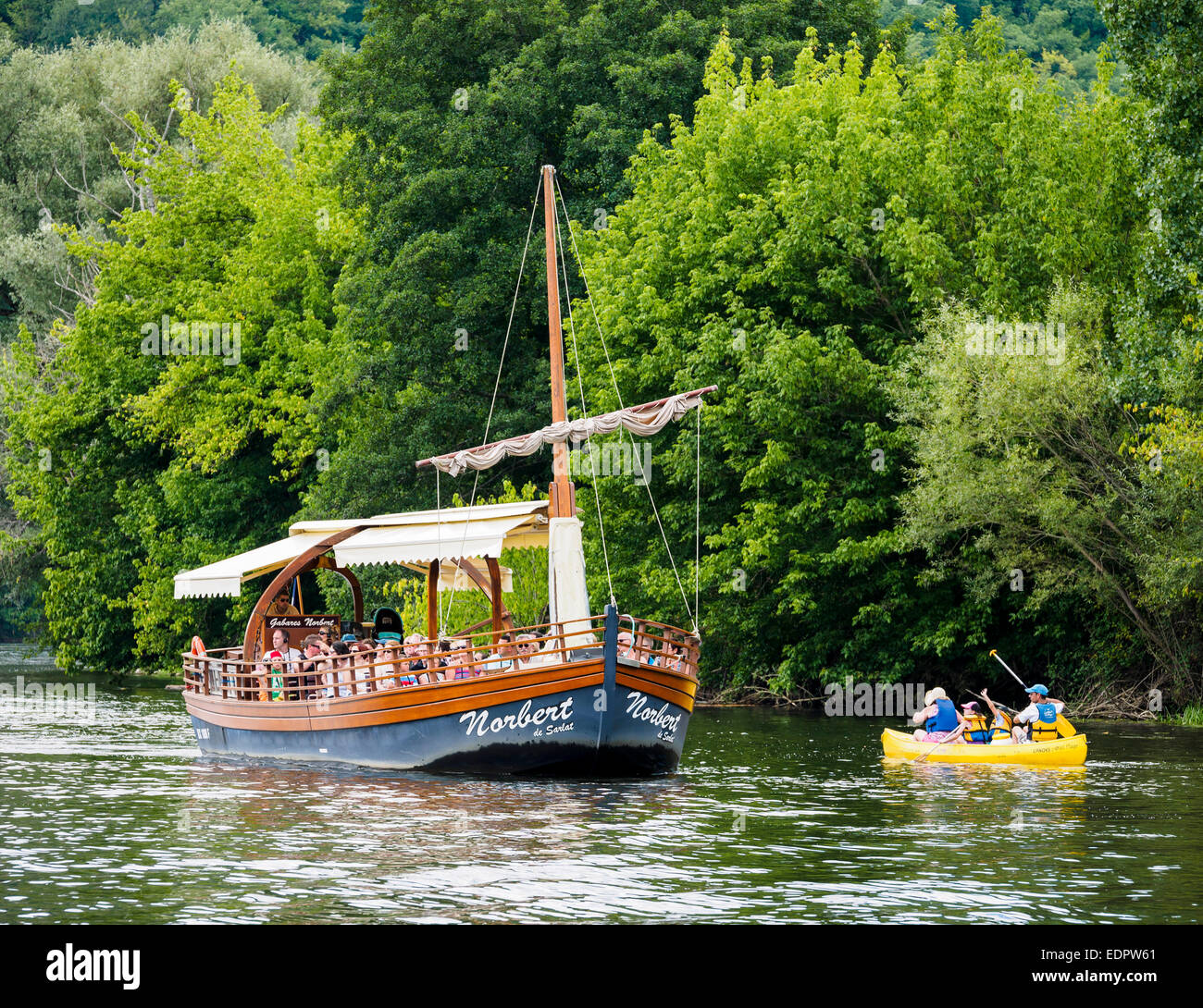 A tourist boat, in French called 'gabare', on the river Dordogne at La Roque-Gageac. Stock Photo