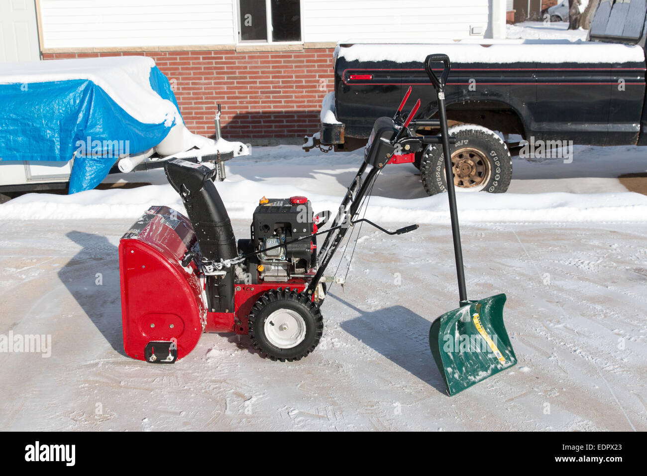 Red snow blower and snow shovel Stock Photo Alamy