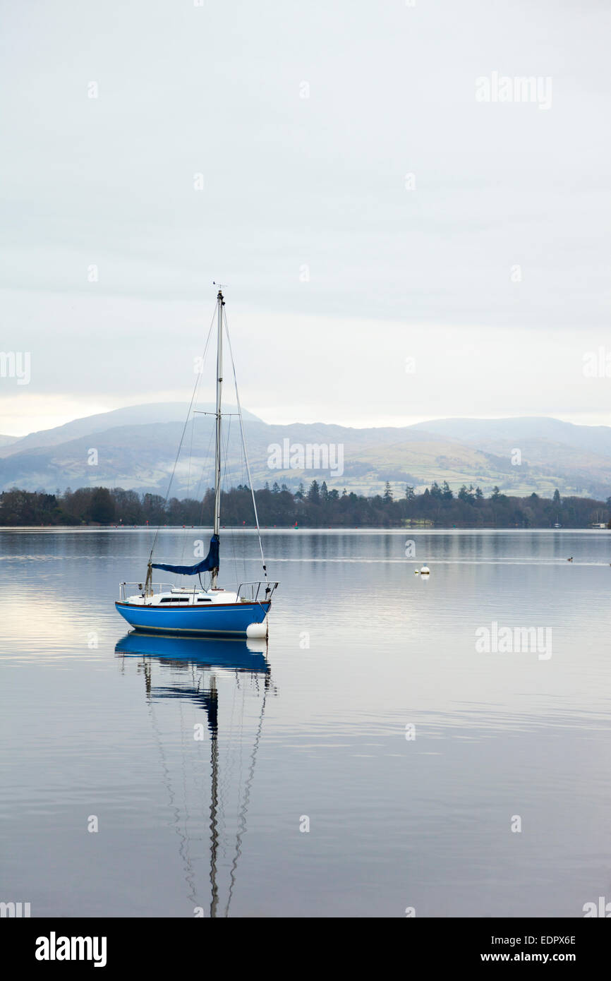 Sailboat on Lake Windemere in early morning - Cumbria, England Stock Photo
