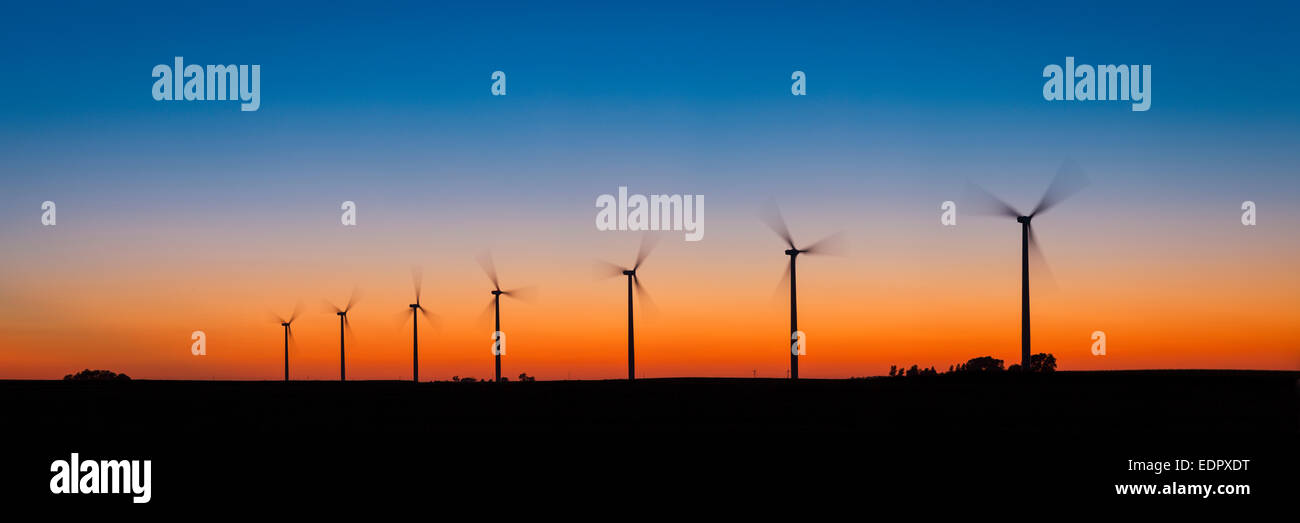 Panorama of wind turbines at sunset.. Stock Photo