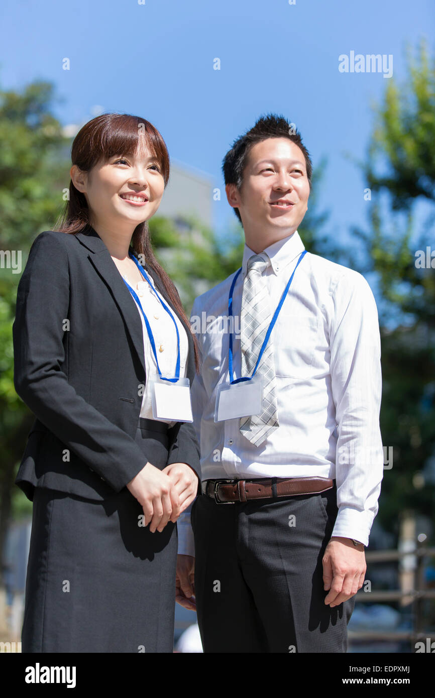 Business People Smiling and Looking into Distance Stock Photo