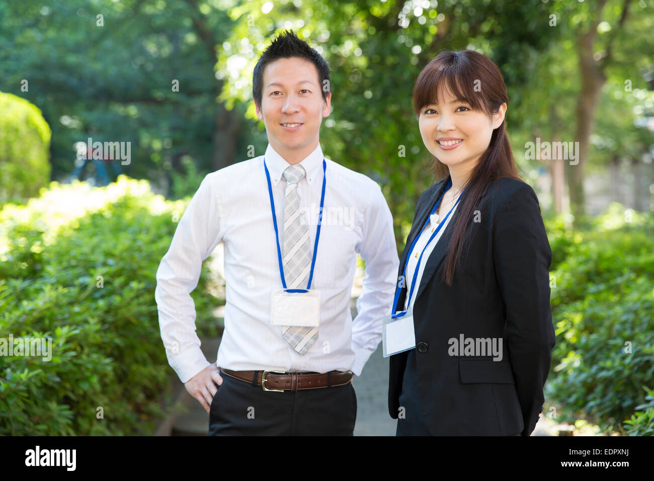 Smiling Business People Looking at Camera Stock Photo