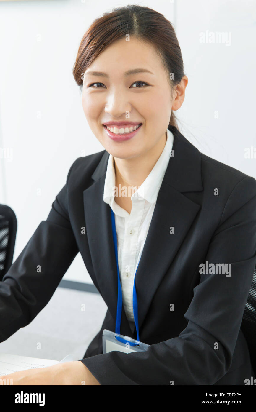Smiling Businesswoman Looking at Camera Stock Photo