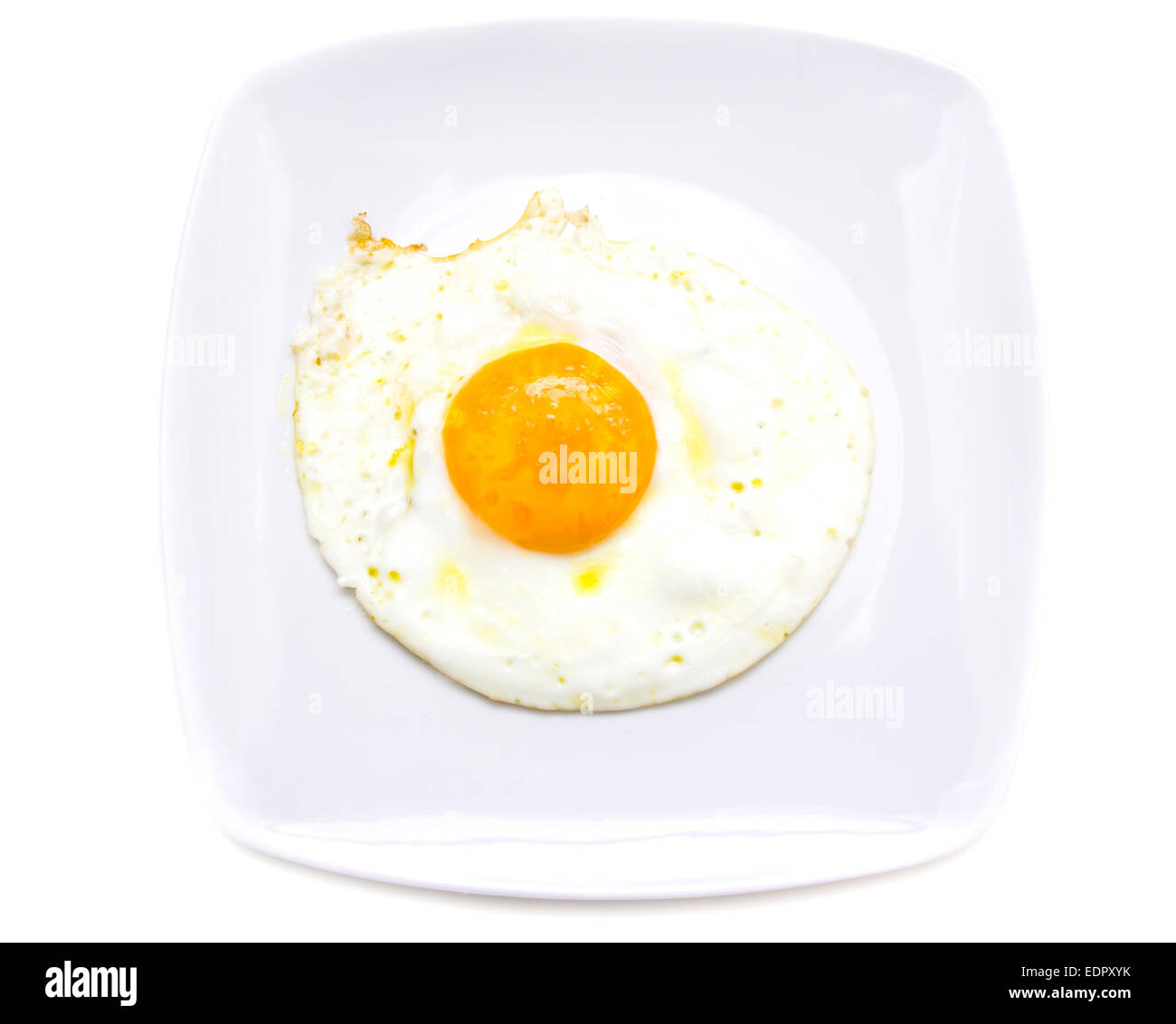 Fried egg on plate on white background seen from above Stock Photo - Alamy